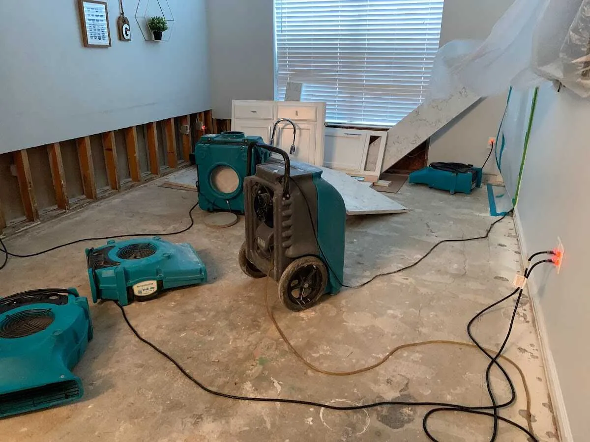 Dehumidifier in flood-cut room for Water Damage Restoration in Hutchison